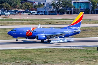 A Southwest Airlines Boeing 737-700 aircraft with registration N409WN and Triple Crown One special livery at Dallas Love Field