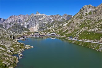 View from the Great St. Bernard Pass over the mountain lake Lac du Grand-St-Bernard to the Italian Alps with the peak Pain de Sucre in Italy