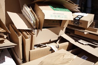 Cartons and stacks of waste paper