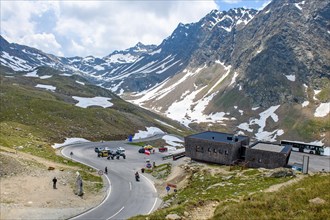 View of curves of pass road mountain road alpine road and car park on Austrian territory of Austria immediately in front of pass height of 2509 metres high alpine pass Timmelsjoch at state border to S...
