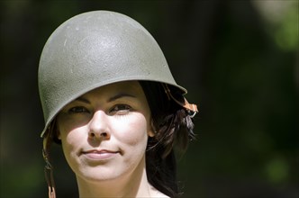 Happy woman with military helmet