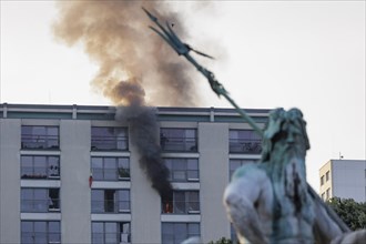 Flames rise from a flat near the Neptune Fountain in Berlin. Berlin