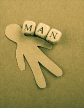 Paper man and man wording with letter cubes on paper