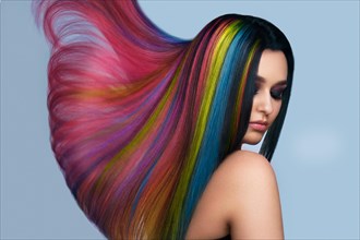 Portrait of beautiful woman with multi-colored hair and creative make up and hairstyle