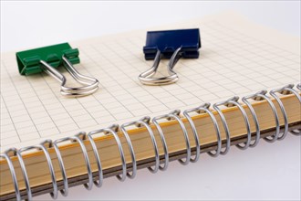 Colorful paper clips on a notebook