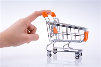 Hand holding a Cart on a white background