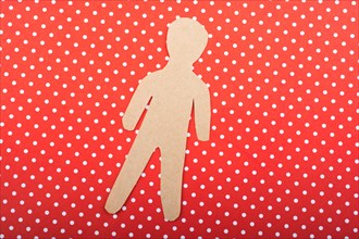Little man figurine cut out of brown paper