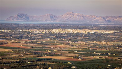 View from mountain Puig Santa Magdalena to the north coast of Majorca with village Muro and peninsula Llevant