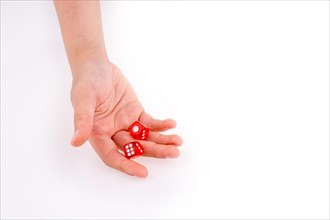 Hand holding red dice on a white background