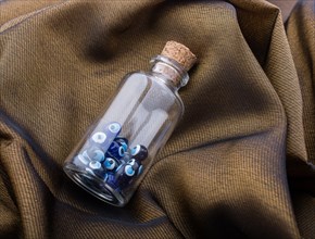 Evil eye bead in bottle as souvenir from Turkey