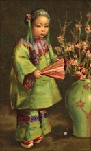 Chinese Girl with a Fan Standing Next to a Large Vase of Flowers