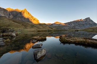 The Blue Lake at sunrise near Melchsee-Frutt on the Aa Alp in the Melch Valley