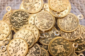 Plenty of fake gold coins are on canvas
