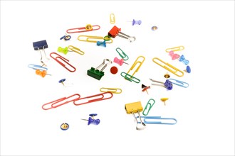 Colurful paperclips scattered around on a white background