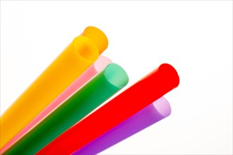 Different color of straw on a white background