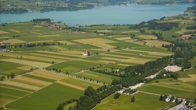 Panorama from the Tegelberg massif to the baroque church of St. Coloman and the Forggensee