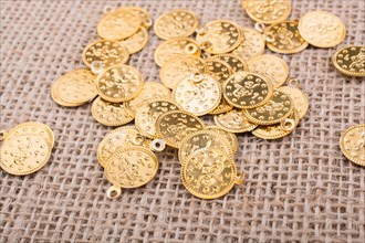 Plenty of fake gold coins are on canvas