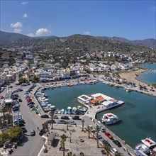 View over the harbour to the beach of Elounda