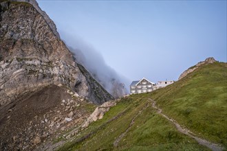 Mountain hut on the Rotstein Pass at sunrise