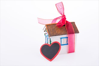 House with ribbon and a heart
