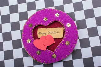 Love icon and Valentine's day wording on torn paper