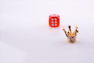 Crown with a dice on a white background