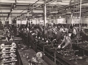 Wolseley factory interior with workers at machinery