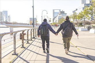 Tourist gay couple exploring Puerto Madero