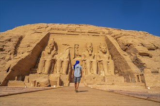 A European tourist visiting the Abu Simbel Temple in southern Egypt in Nubia next to Lake Nasser. Temple of Pharaoh Ramses II