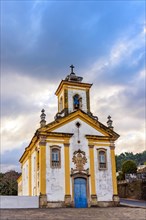 Front view of a historic baroque church in the old town of Ouro Preto in Minas Gerais