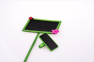 Green framed signboards with a flower and ladybug on a white background