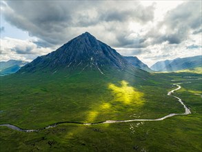Sun Rays over The Buachaille or Buachaille Etive Mor and River Coupall from a drone