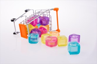 Colorful blocks come out of a tumbled shopping cart