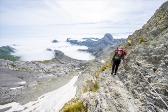 Mountaineer climbing Saentis over the Lisen ridge
