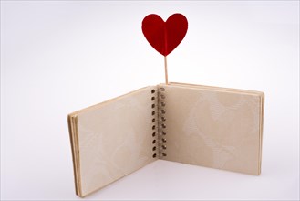 Red hearted stick on a notebook