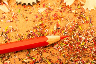 Red Color Pencil over some pencil shavings