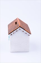 Small model houseon a white background