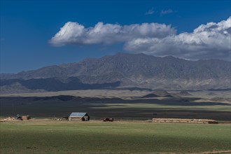 Farm in the steppe beyond the Kolsay Lakes National Park