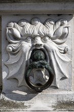 Artfully decorated door knocker on the town hall of Bruges