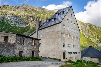 View of historic hotel accommodation Ospizio San Gottardo Sankt Gotthard Hospiz with historic buildings from year 1237 13th century on 2091 metres high Gotthard Pass