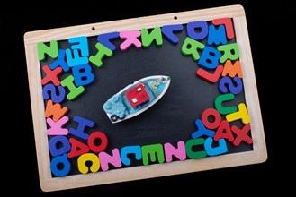 Model boat and Colorful wooden Letters of Alphabet
