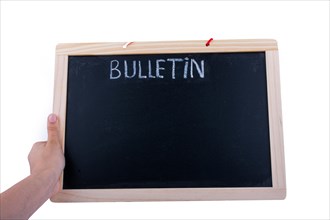Hand holding the board with the title of bulletin