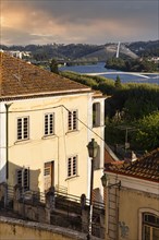 View over rooftops on river Mondego with Ponte Rainha Santa Isabel and Ponte Pedro e Ines