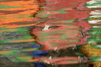 Colourful reflections on the water surface