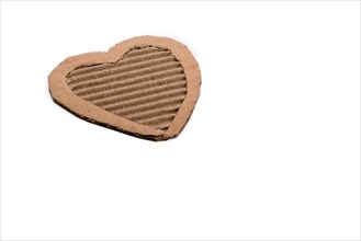 Heart shape cut out of a cardboard paper