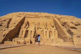A European tourist visiting the Abu Simbel Temple in southern Egypt in Nubia next to Lake Nasser. Temple of Pharaoh Ramses II