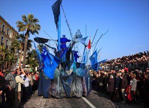 Fatasieful blue motif float at the street parade in Menton