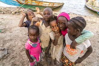 Children on the riverbank in the village of Kajata on Jinack Island