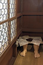 Reconstructed historical dry toilet in a medieval house