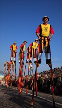 Stilt walkers in the street parade in Menton